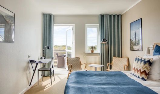 Dobbeltværelse med siddeområde og balkon